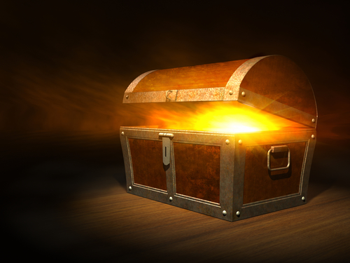 Old wooden treasure chest with strong glow from inside