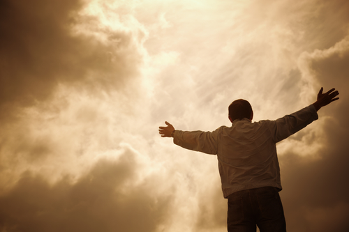 man and drammatic clouds, religion concept, selective focus