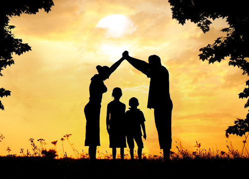 Silhouette, group of happy children playing on meadow, sunset, summertime