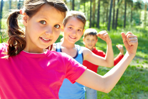 Three little children posing at camera